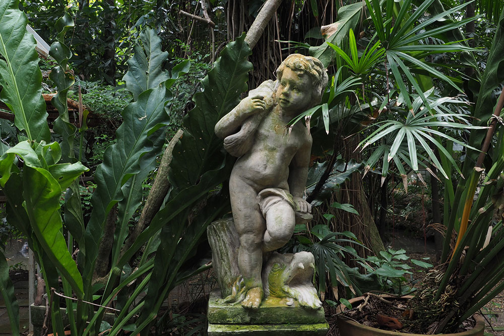 Transform Your Garden with Elegant Arbors and Artistic Statues