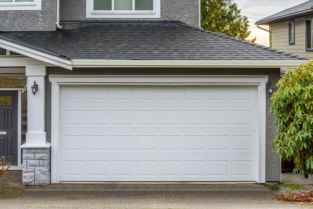 Modern Residential Garage Doors: Vinyl vs. Wooden Options